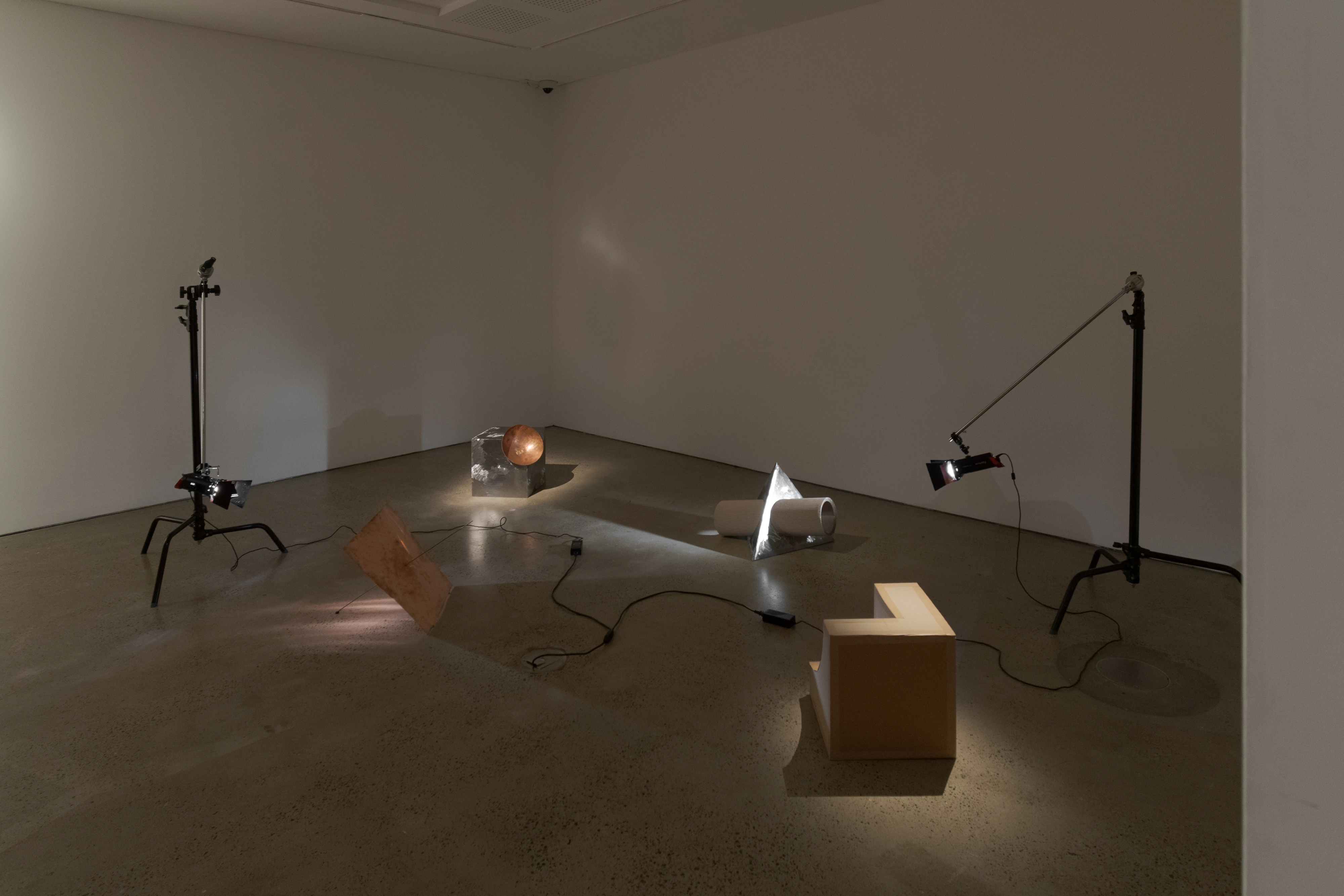 Three fragments of a passport installed off a wall